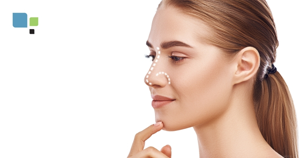 A woman with pre-surgical markings on her nose in preparation for rhinoplasty (MODEL) Primera Plastic Surgery Logo